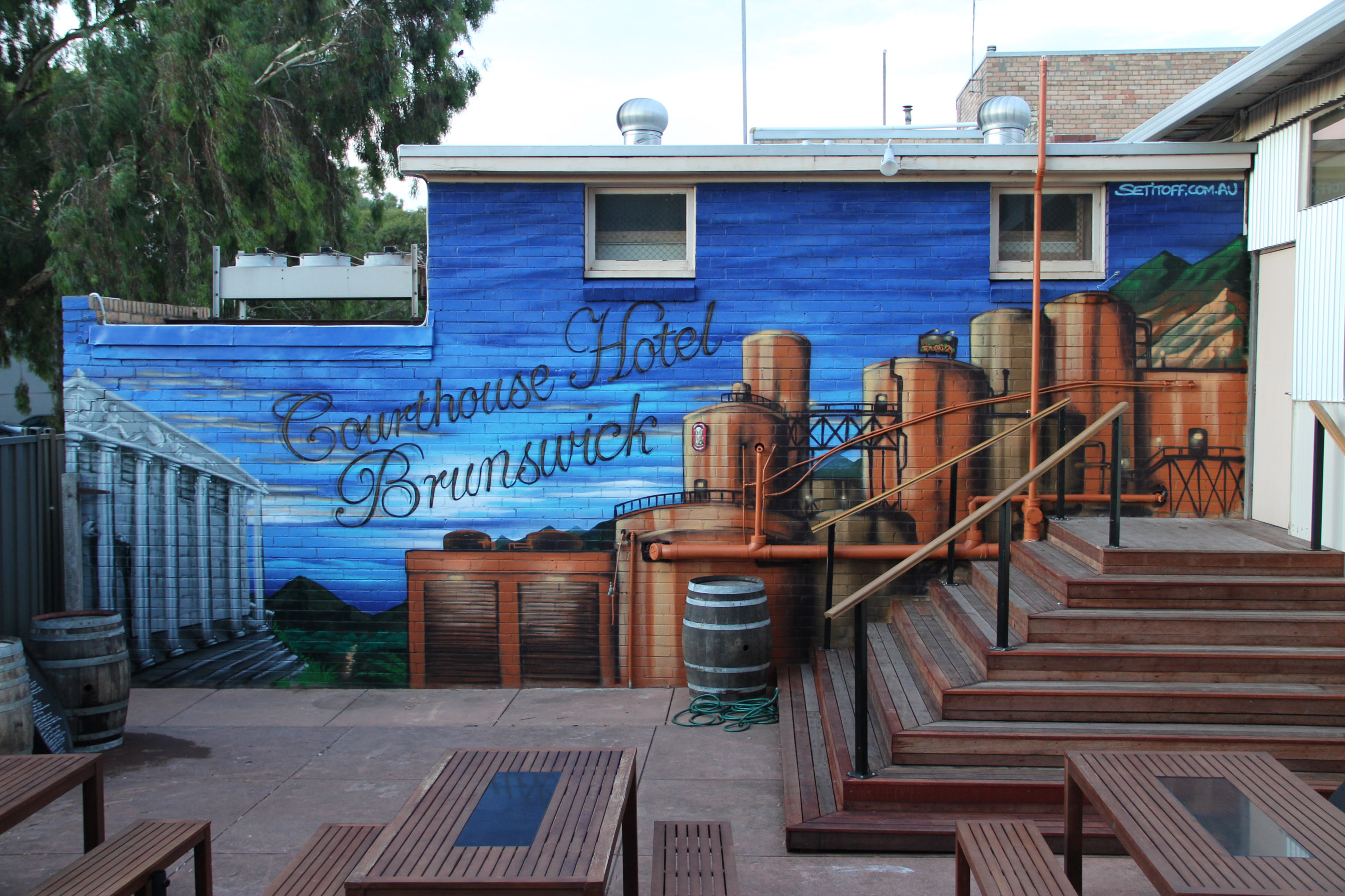 Courthouse hotel beer garden wall mural exterior