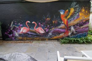 Outdoor graffiti mural of birds
