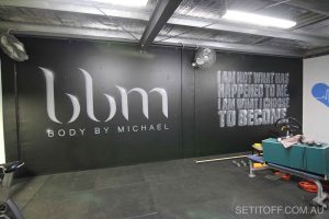 Motivational quote graffiti in a gym