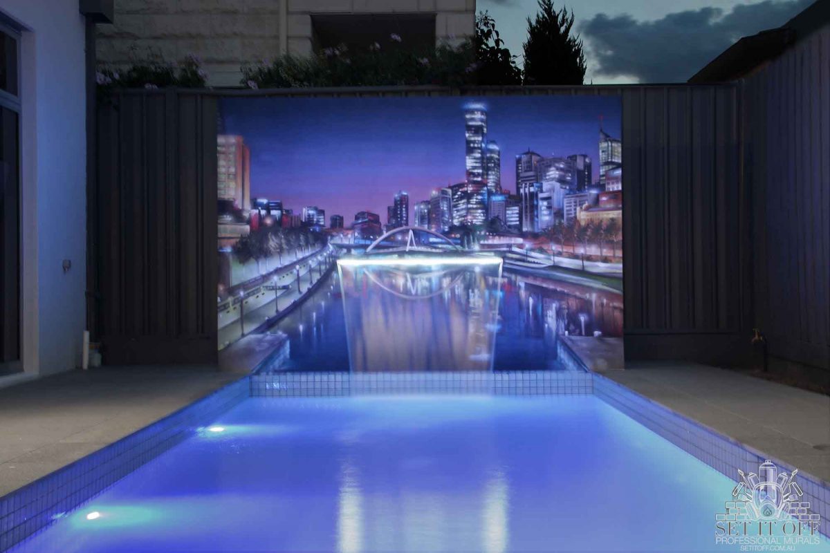 Poolside cityscape wall mural with incorporated fountain