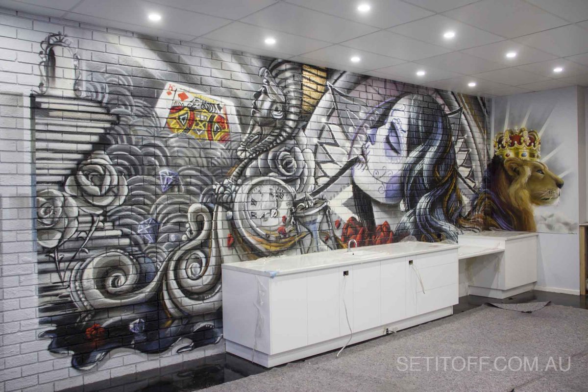 A tattoo-style wall mural in Kings of Ink tattoo studio.