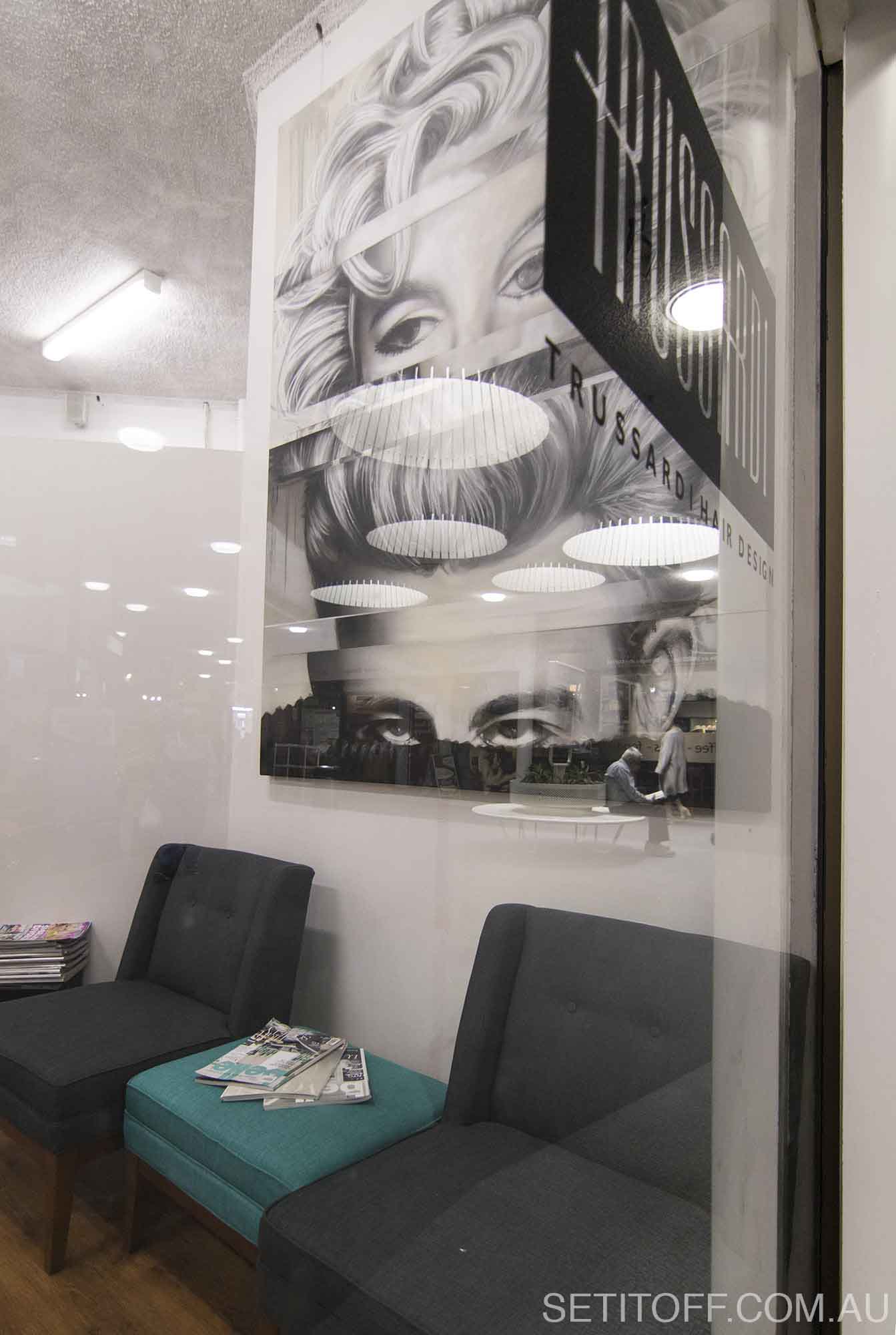 Portrait of Marilyn Monroe and James Dean on a canvas in hair salon