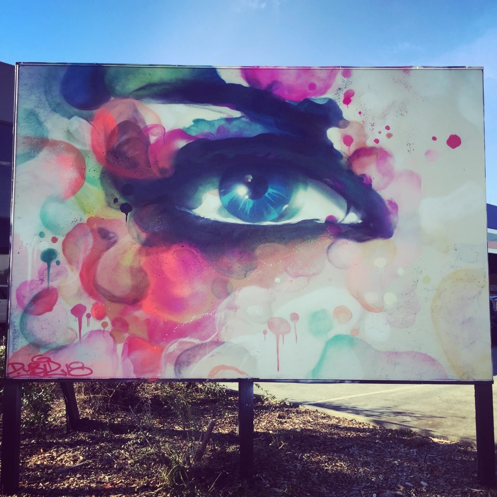 Graffiti of an eye in a abstract style on a billboard