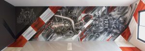 Graffiti mural of a motorcycle engine