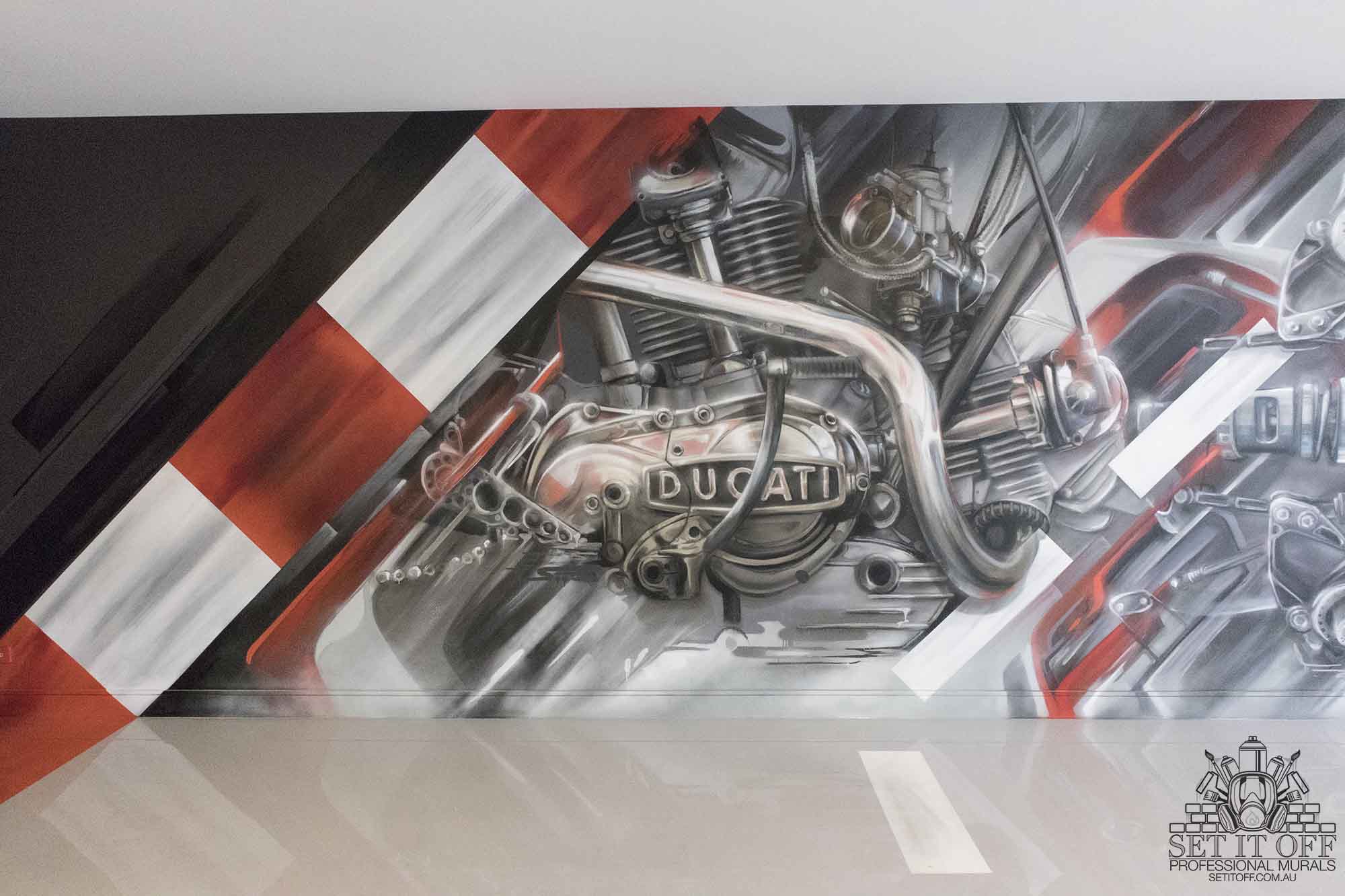 Graffiti mural of a motorcycle engine